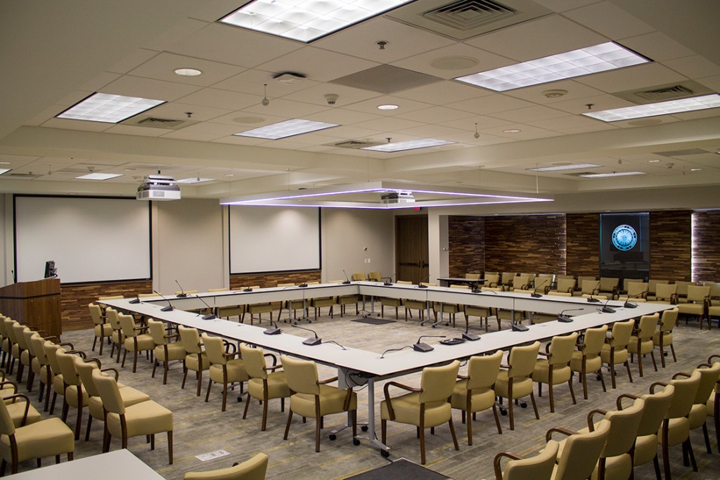 Large meeting room with projector equipment and adjustable tables