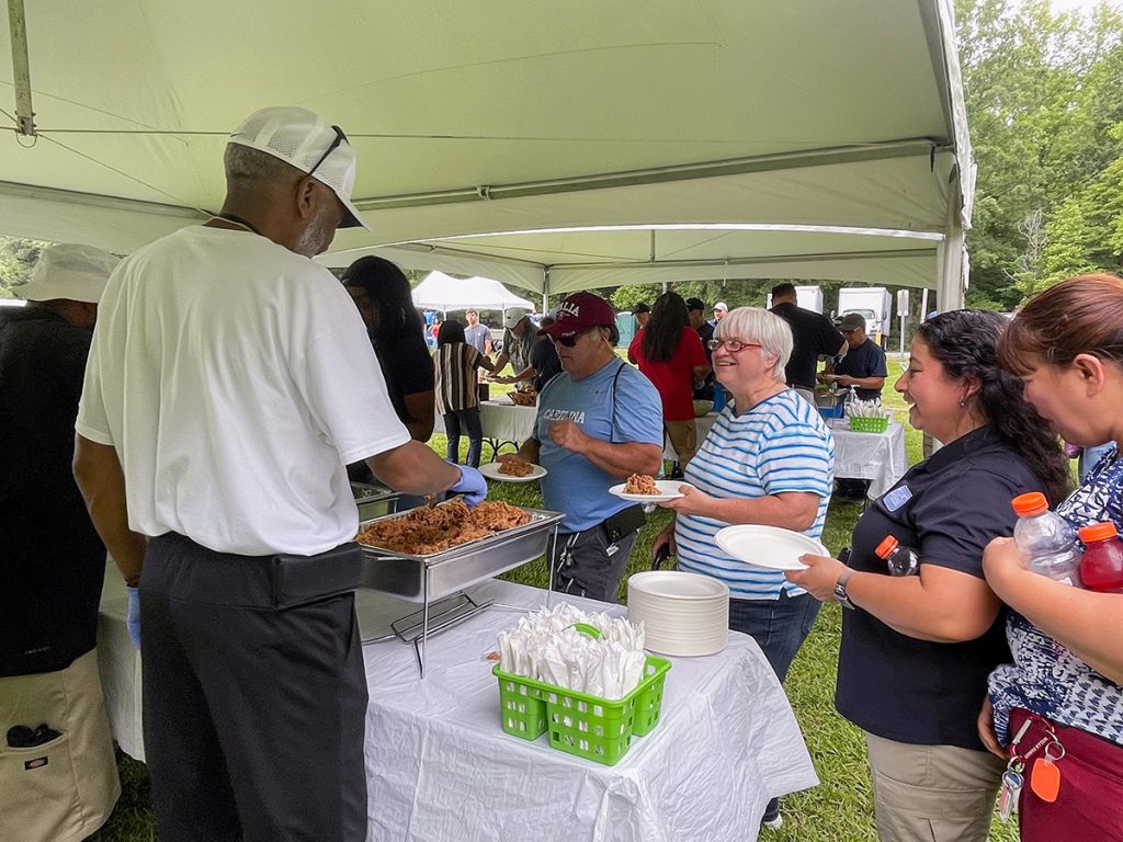 Facilities Services staff being served food